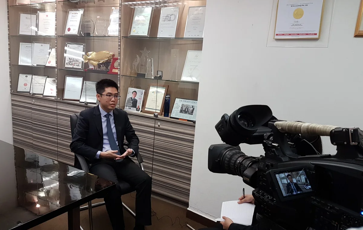 Lawrence Chai being interviewed on camera at the Singapore Media Academy